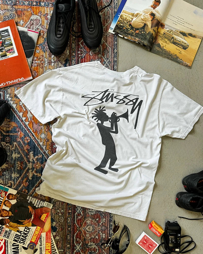 Vintage skate and surf collection featuring Stüssy ‘All That Jazz’ t-shirts, graphic tees, and 90s beachwear inspired by California street style.  Surf Clothing. 90s Skate Fashion.